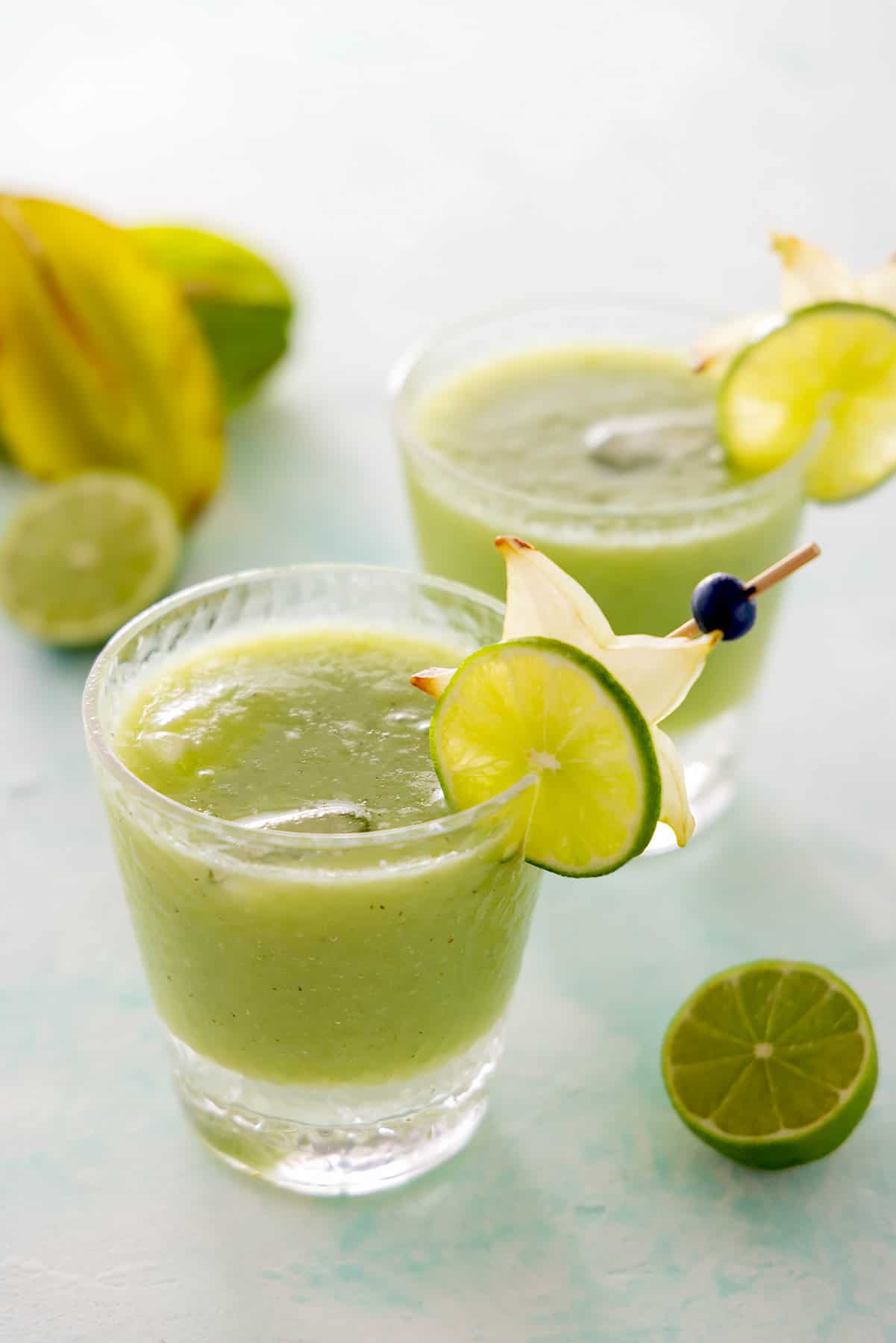 2 glasses of Starbucks-inspired lemonade kiwi starfruit refresher mocktail.