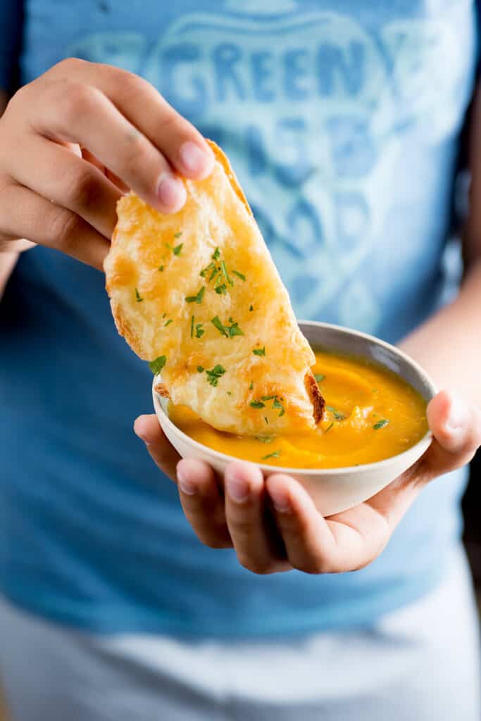 Creamy pumpkin soup with cheese crostini