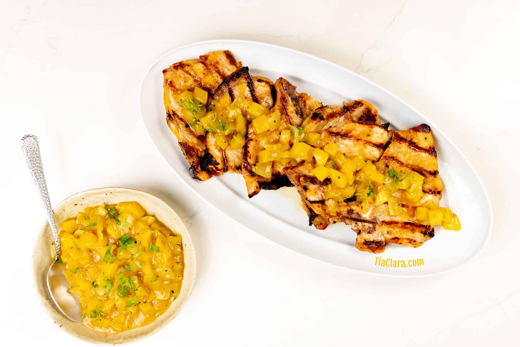 Sweet and spicy pork chops with mango salsa.