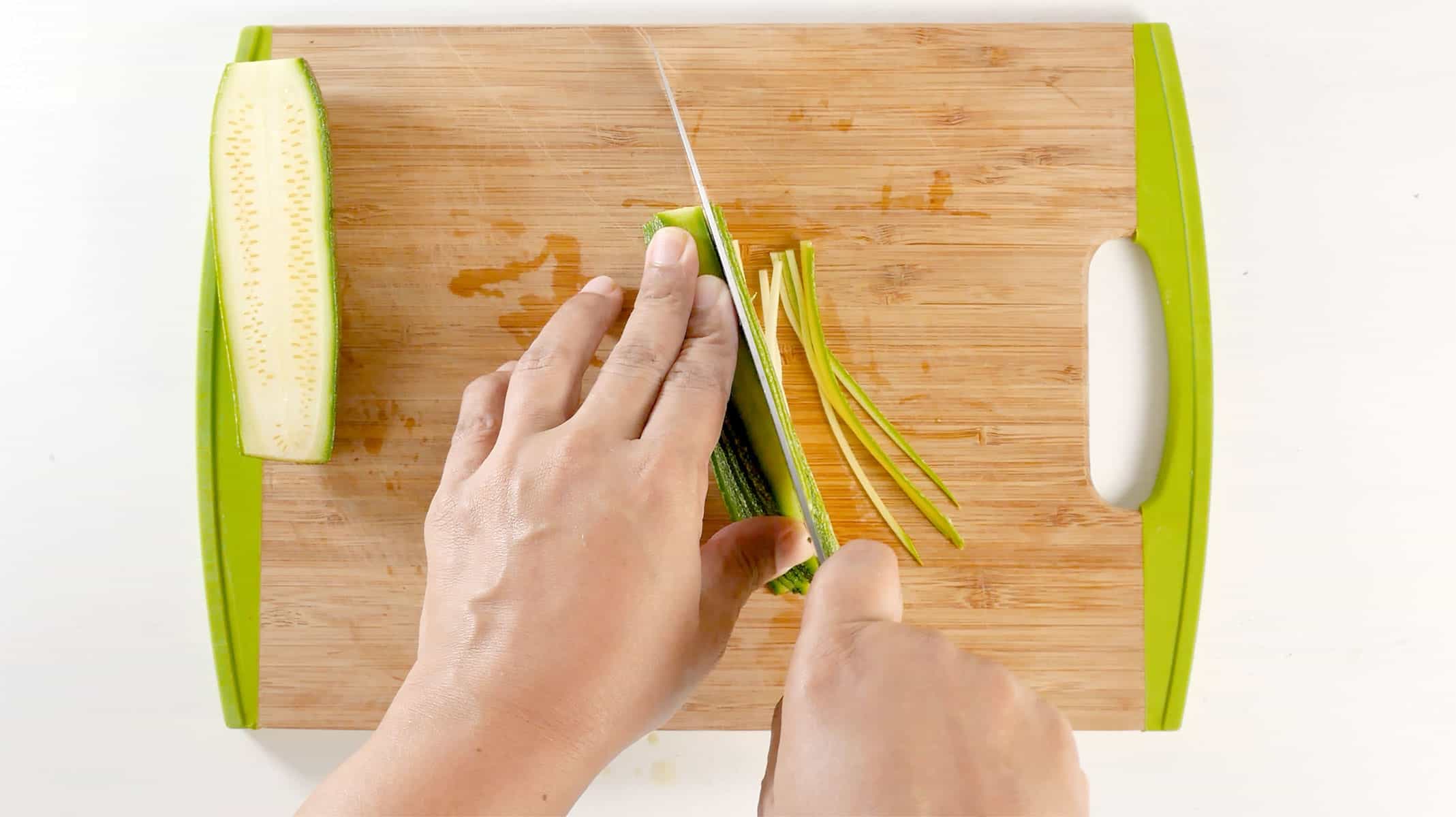 Cutting zoodles with a knife.
