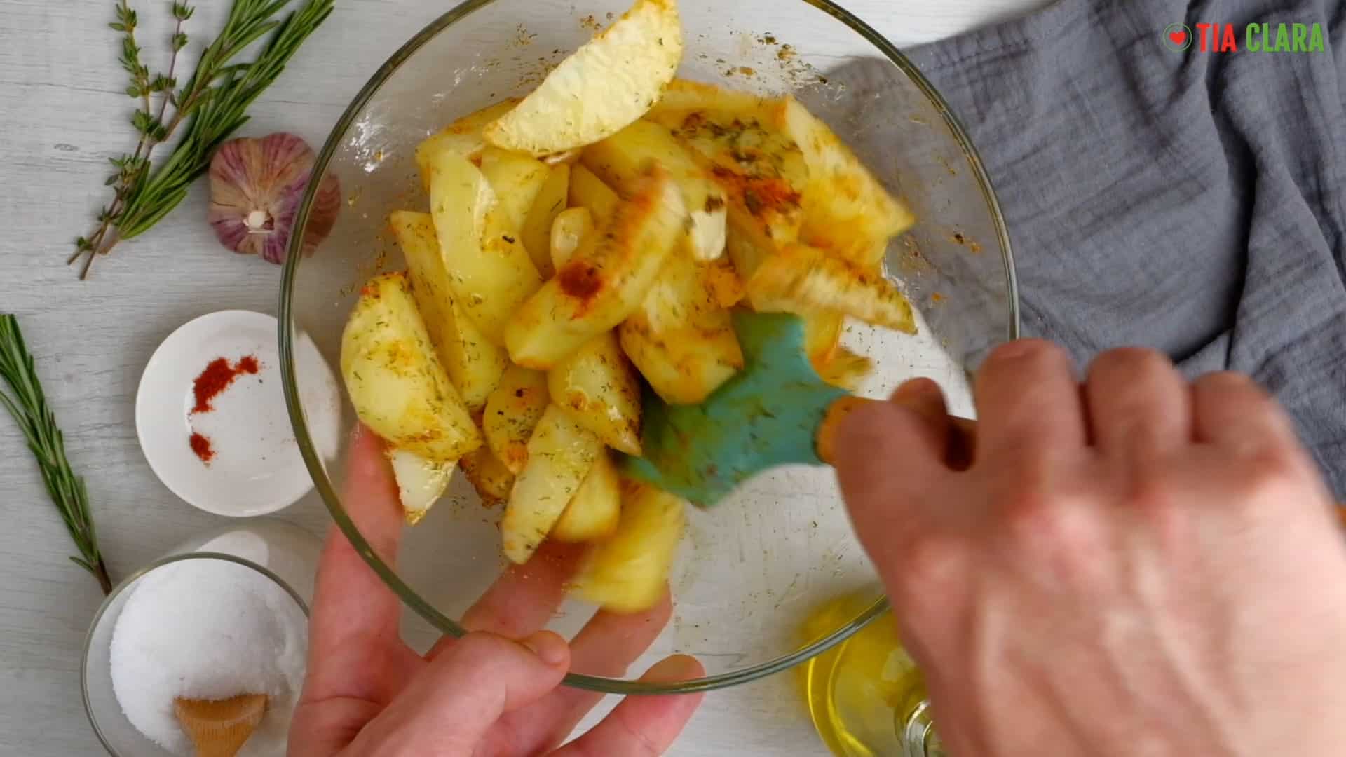 Seasoning potatoes.