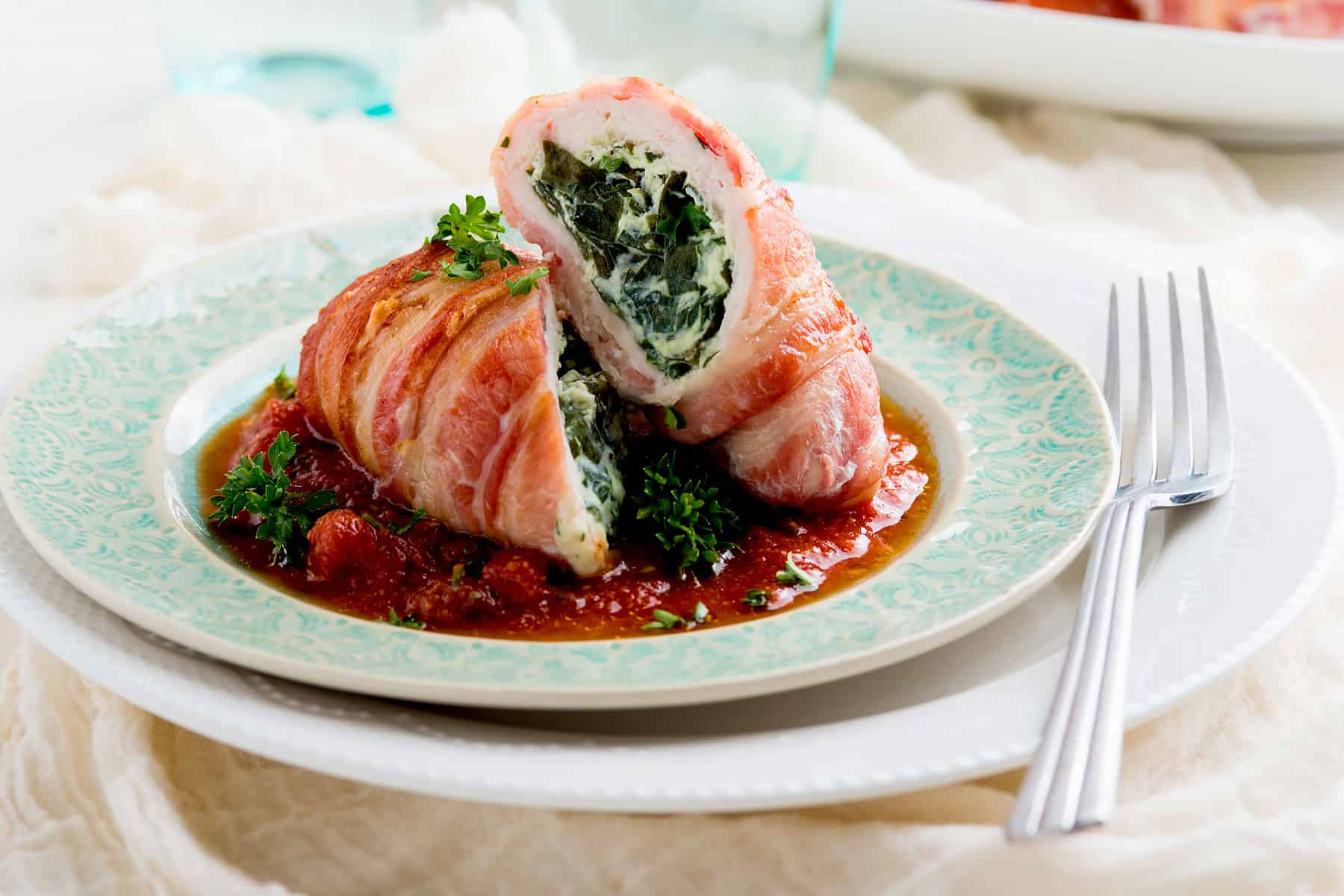 Bacon-wrapped chicken breast rolls.