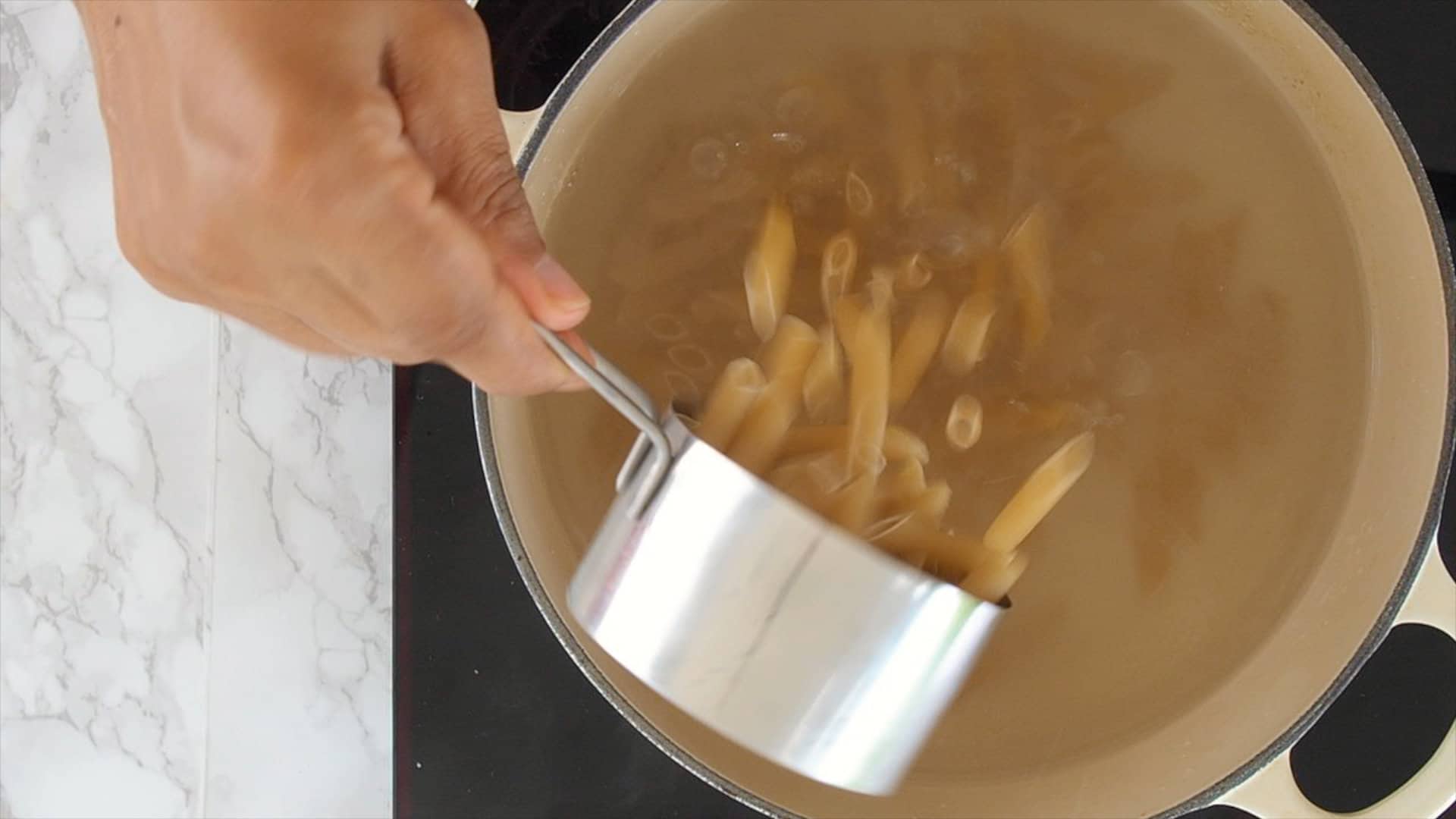 Boiling pasta.