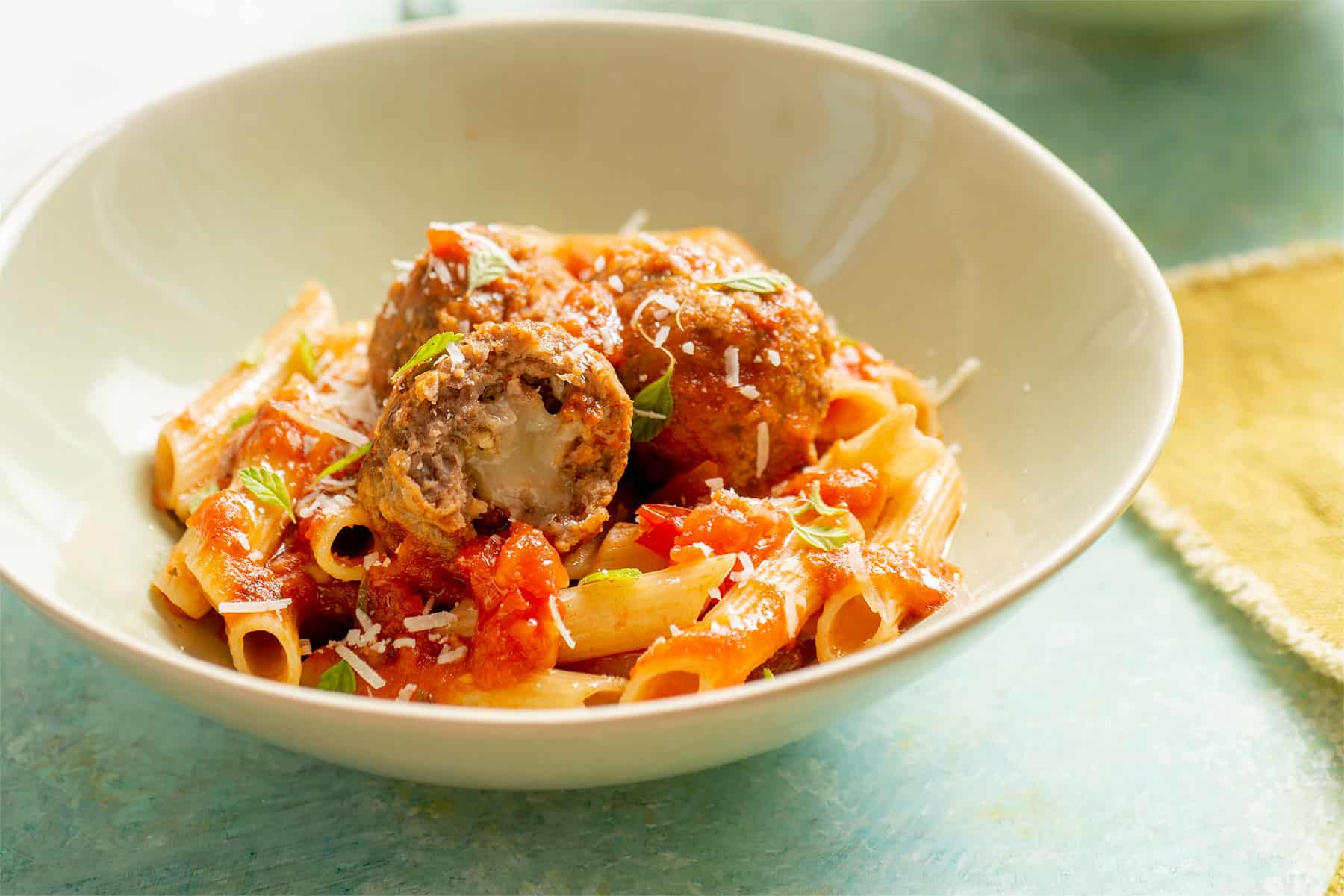 Meatballs with penne and tomato sauce.