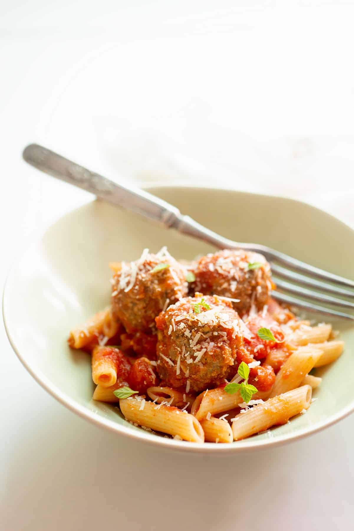 Mozzarella-stuffed meatballs with pasta.