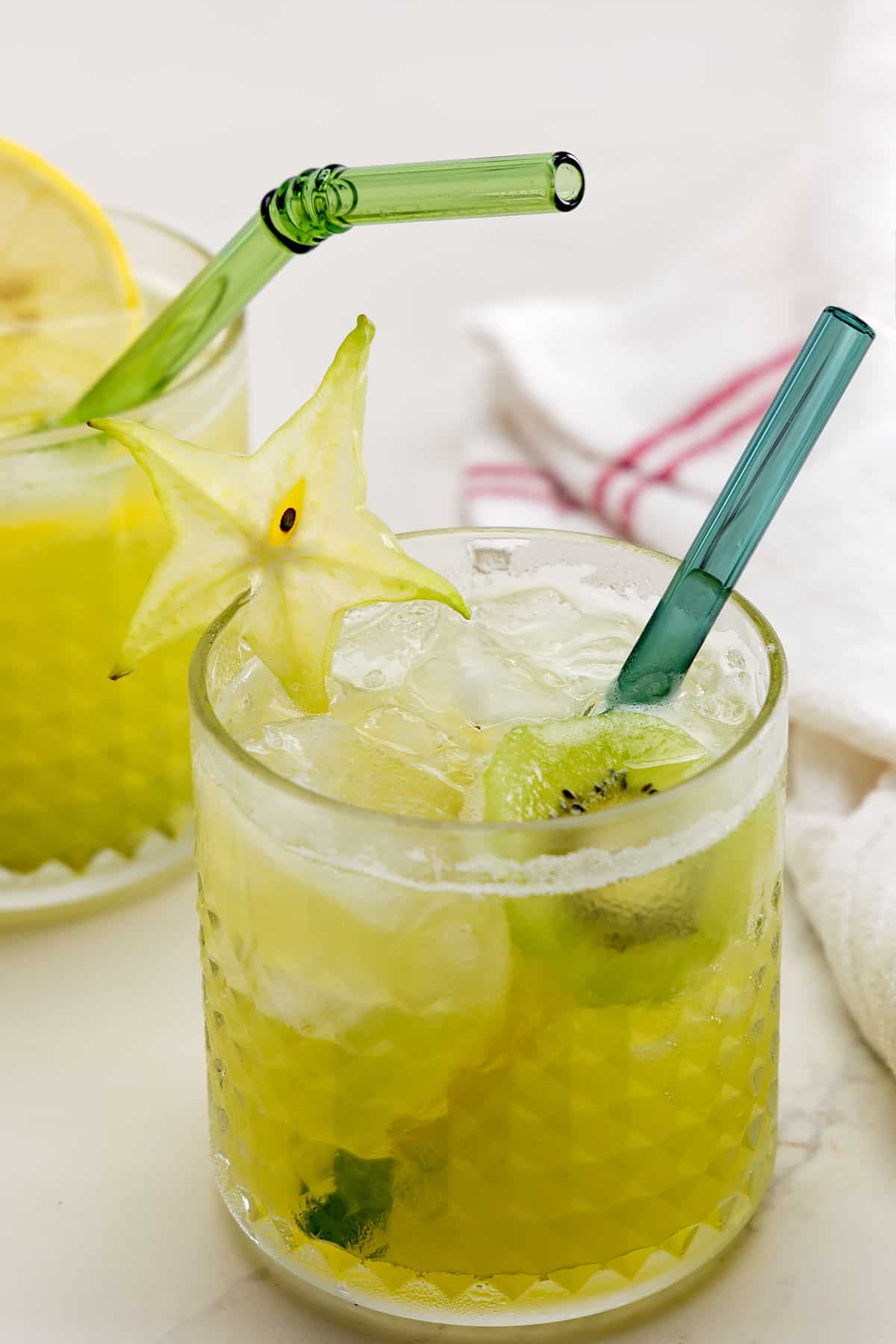 Starbucks-inspired lemonade kiwi starfruit refresher mocktail.