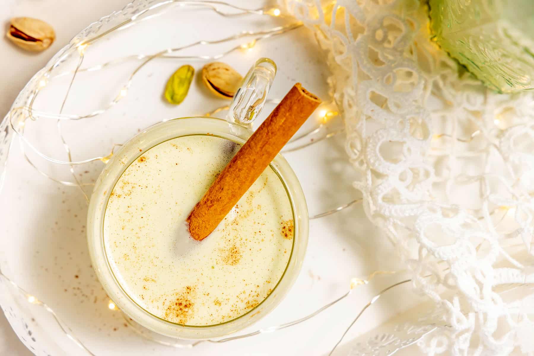 Coquito served with cinnamon stick.
