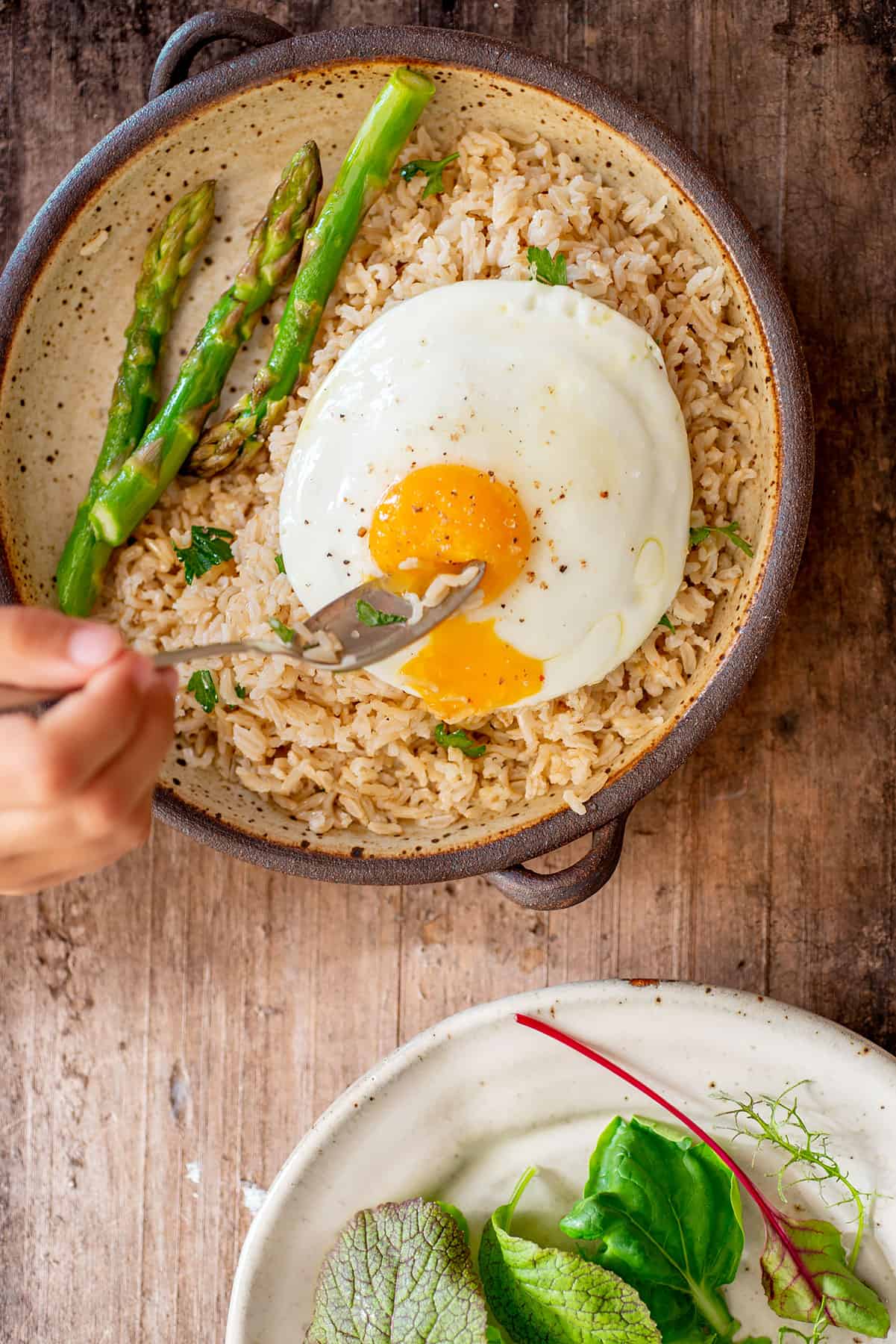 Brown rice pilaf served with egg.