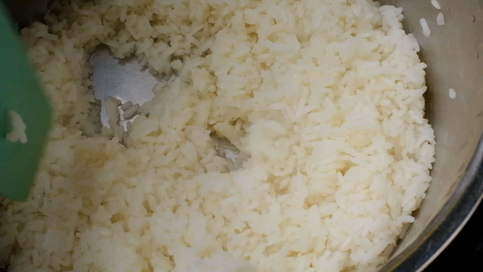 Fluffing rice.