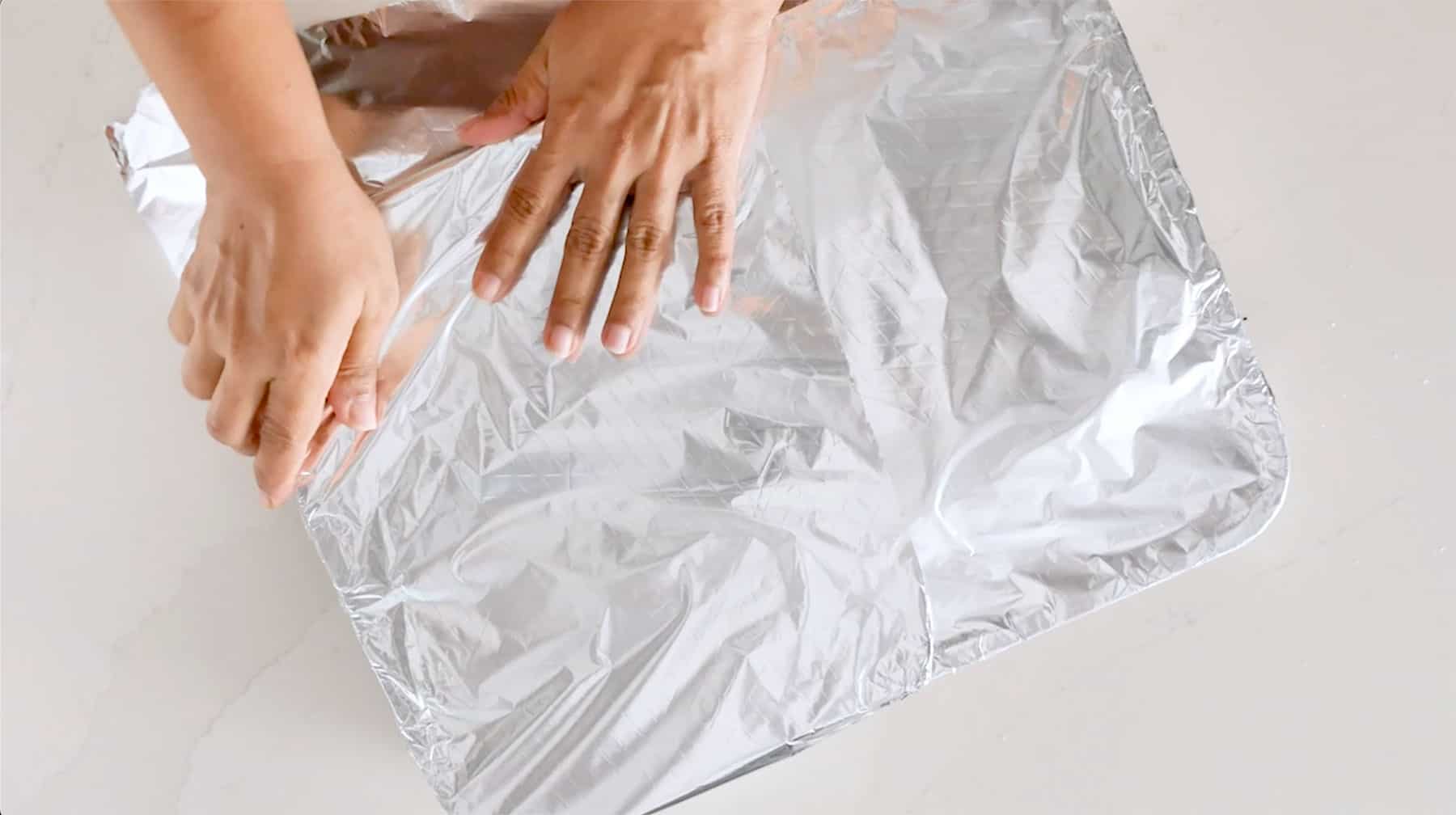 Covering tray with aluminum foil.