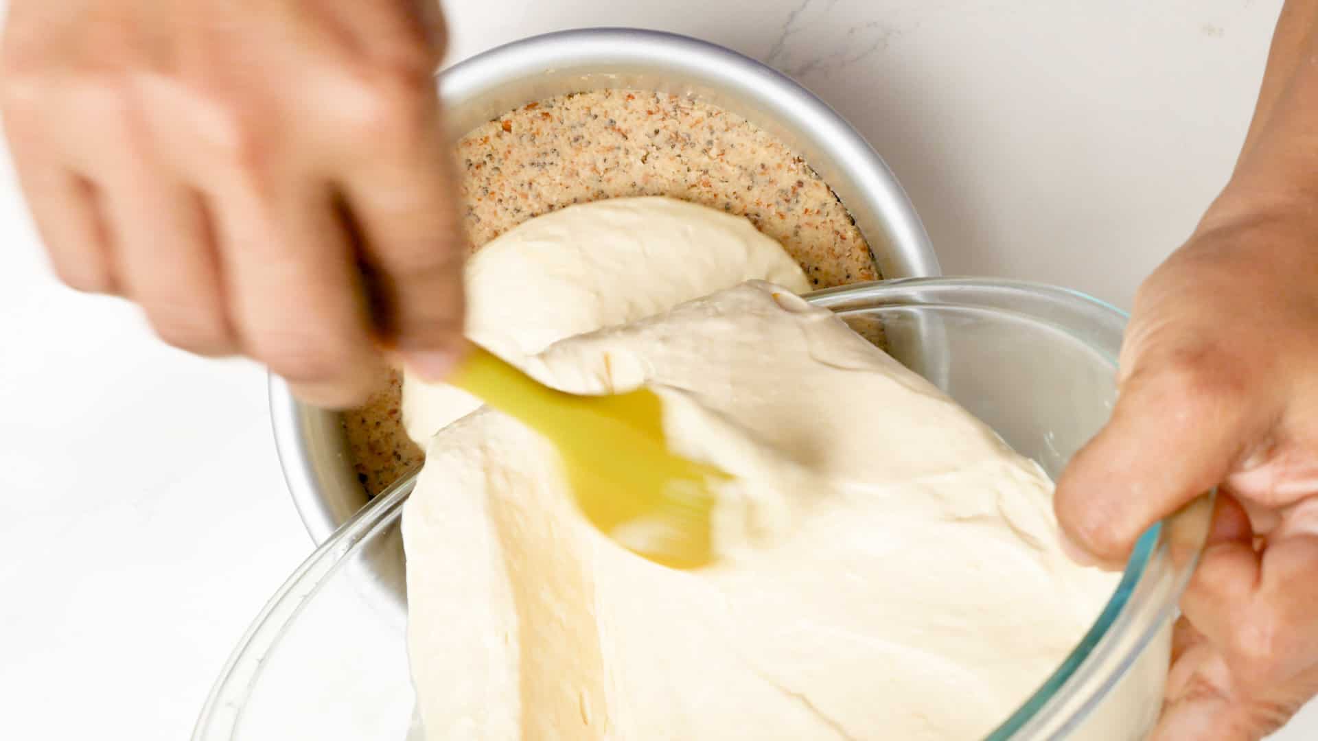 Pouring the cream cheese layer.