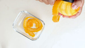 Peeling oranges.