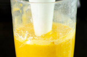 Blending carrot soup.
