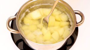 Boiling potatoes.
