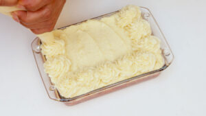 Piping mashed potatoes.