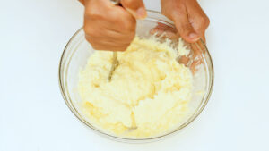 Mashing potatoes.