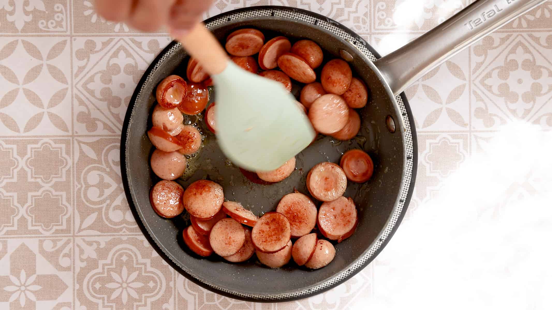 Browning the sausage.
