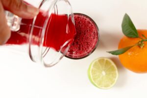 Pouring beet carrot juice.